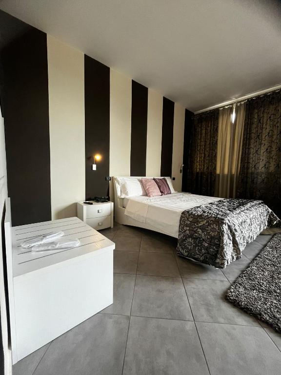 Postel nebo postele na pokoji v ubytování Hotel Saturday