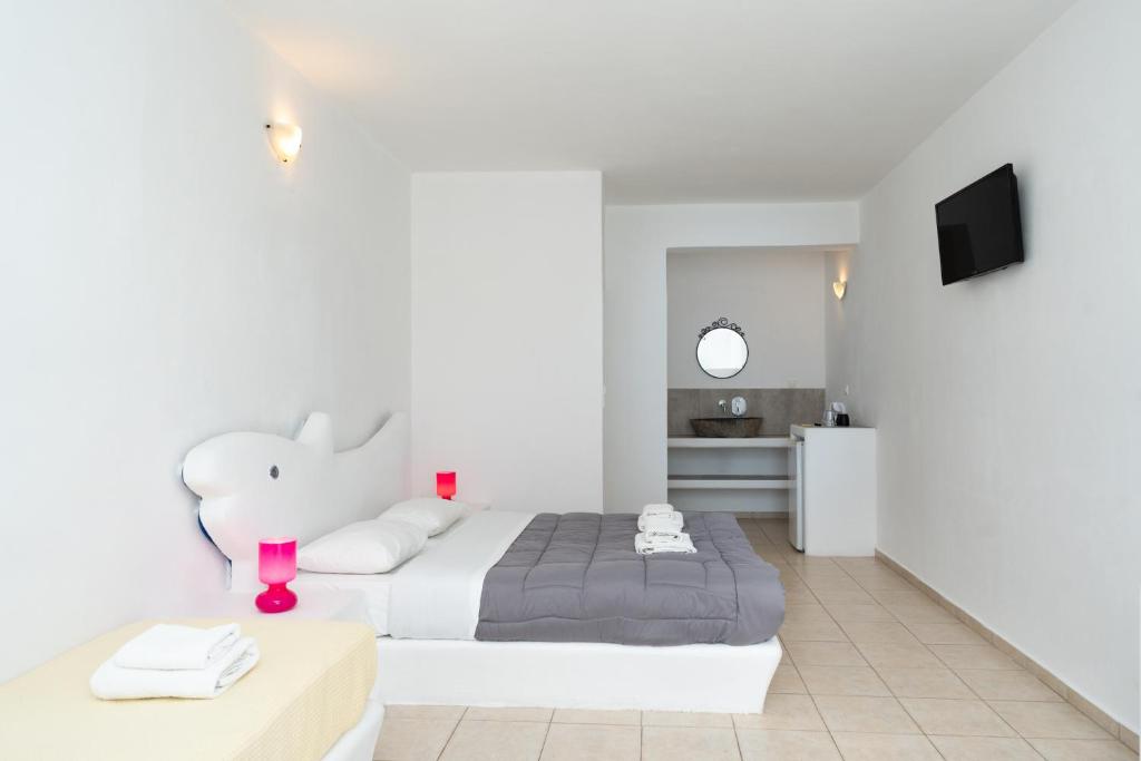Postel nebo postele na pokoji v ubytování ILIADA-ODYSSEAS RESORT