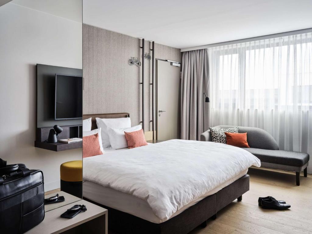 Postel nebo postele na pokoji v ubytování ATLANTIC Hotel Münster