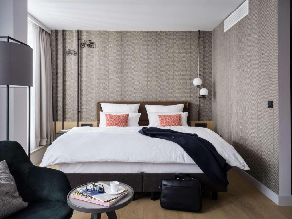 Postel nebo postele na pokoji v ubytování ATLANTIC Hotel Münster