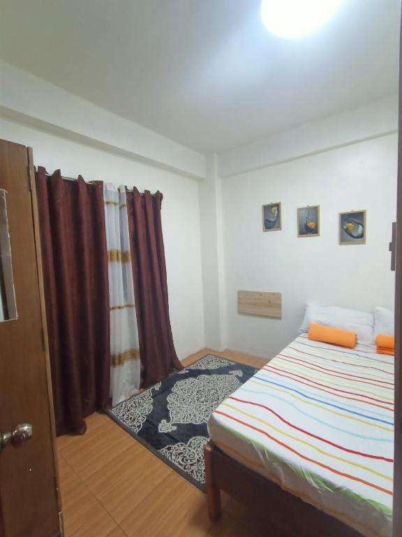 Postel nebo postele na pokoji v ubytování 017 Baguio Transient
