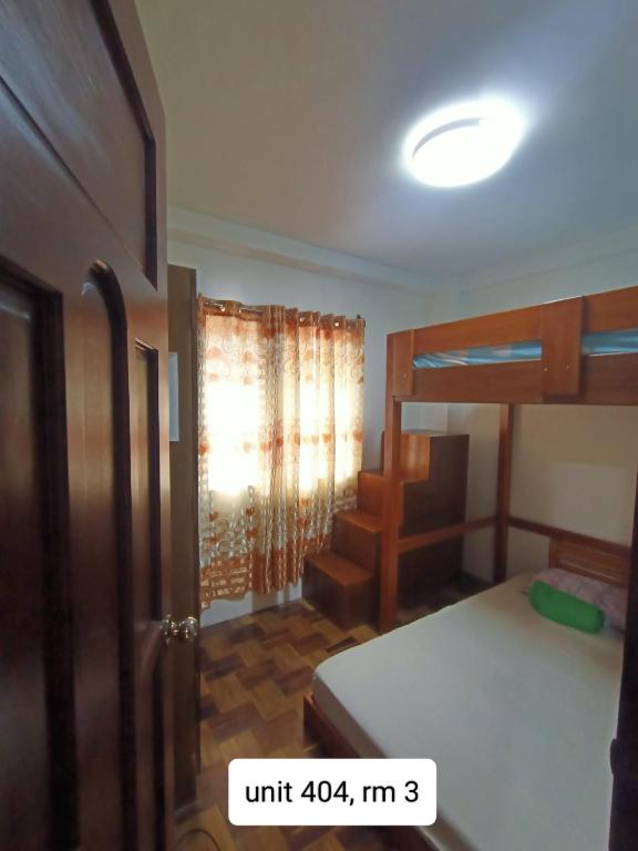 Postel nebo postele na pokoji v ubytování 017 Baguio Transient