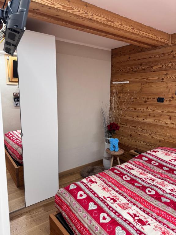Postel nebo postele na pokoji v ubytování Residenze Vezza - Il Larice -
