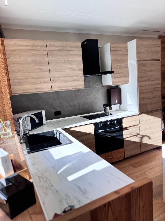 Kuchyň nebo kuchyňský kout v ubytování Residenze Vezza - Il Larice -