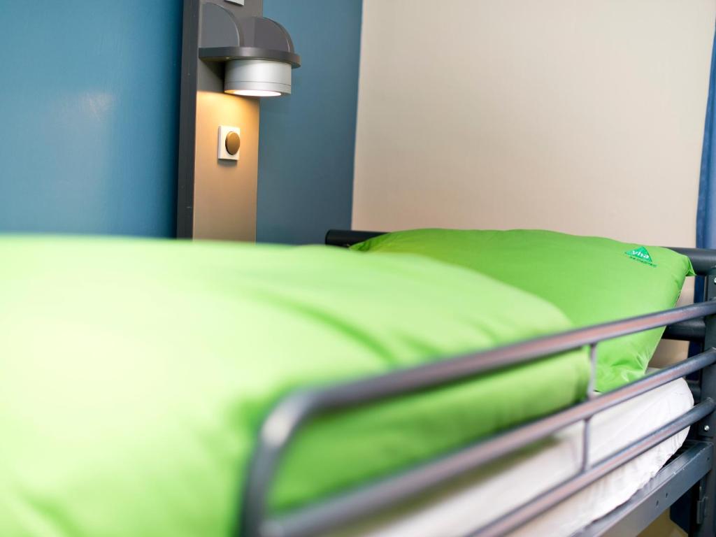 Postel nebo postele na pokoji v ubytování YHA Wasdale Hall