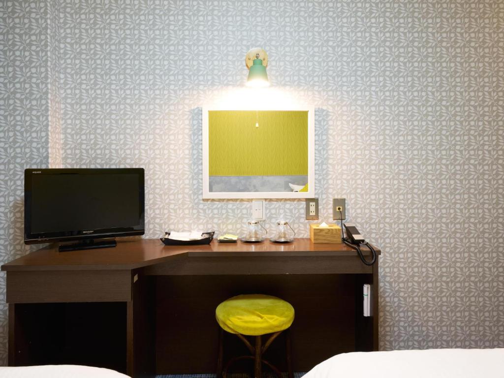 TV a/nebo společenská místnost v ubytování Hotel Village