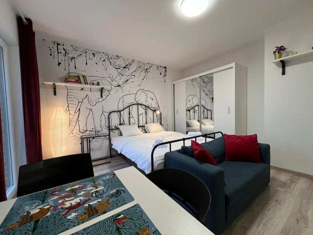 Posteľ alebo postele v izbe v ubytovaní Wileńska Express Apartment
