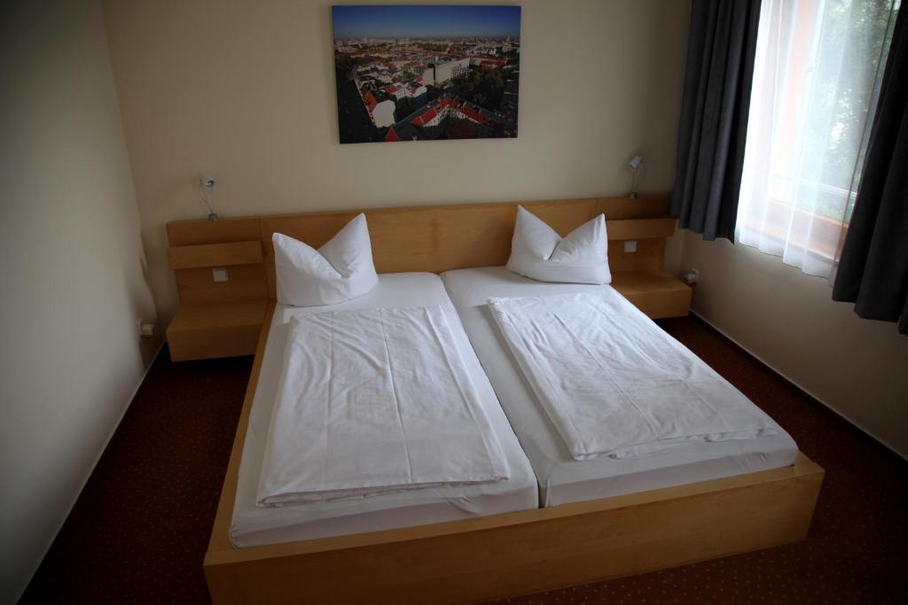 Postel nebo postele na pokoji v ubytování Hotel 26