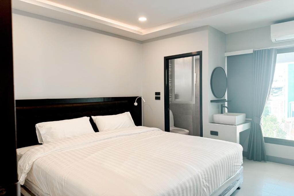 Postel nebo postele na pokoji v ubytování Smith Hotel