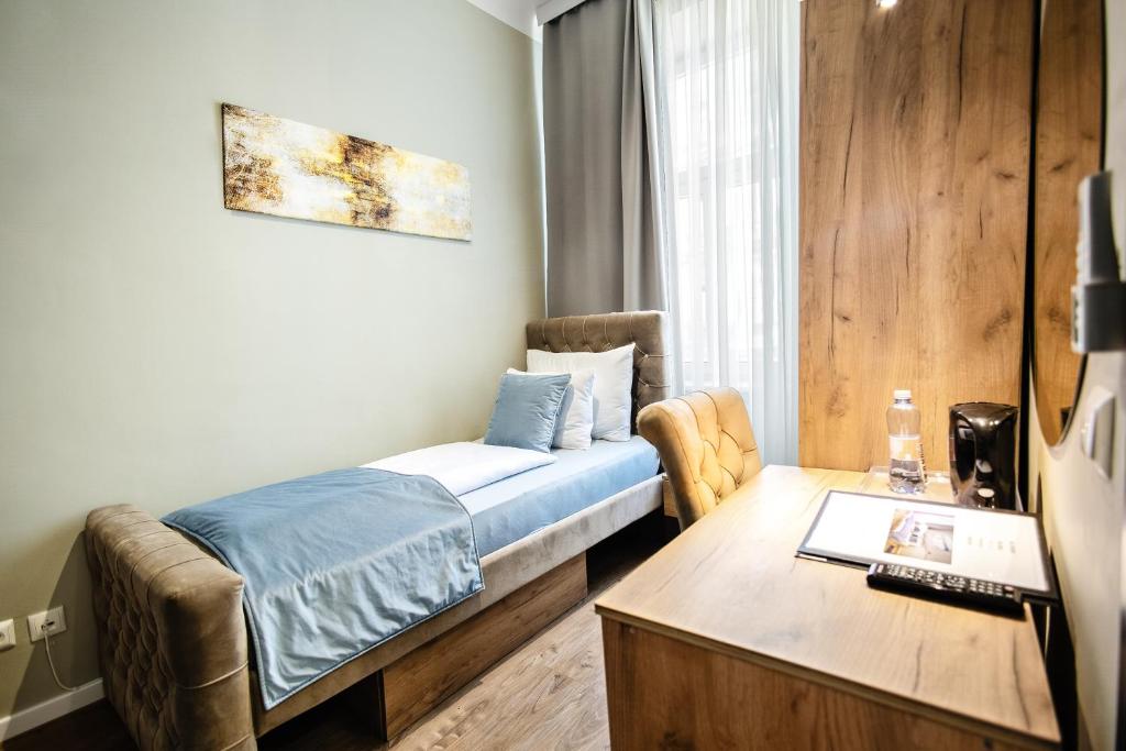 Postel nebo postele na pokoji v ubytování Vayalen Boutique Hotel