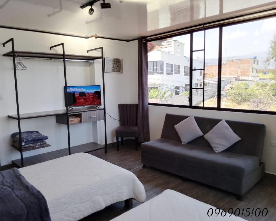 Postel nebo postele na pokoji v ubytování Hotel Ciudad Ambato