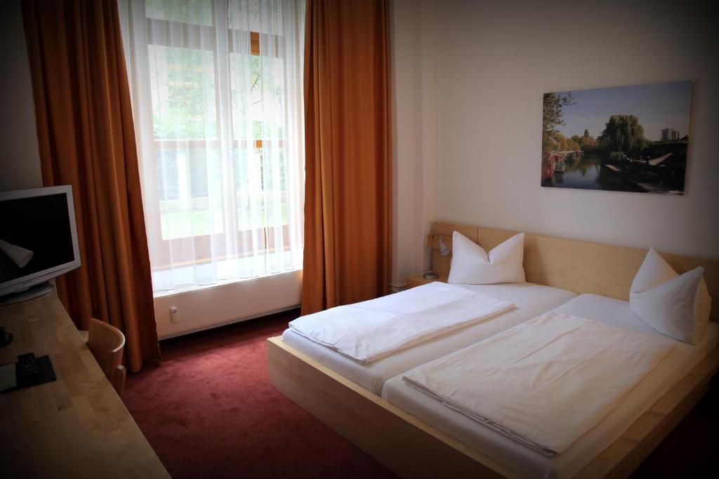 Postel nebo postele na pokoji v ubytování Hotel 26