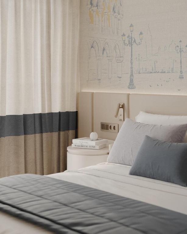a bedroom with a white bed and a curtain at Ducale Lara - Ultra All Inclusive in Lara