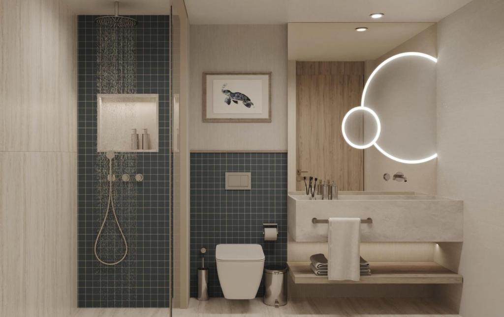 a bathroom with a shower and a toilet and a sink at Ducale Lara - Ultra All Inclusive in Lara