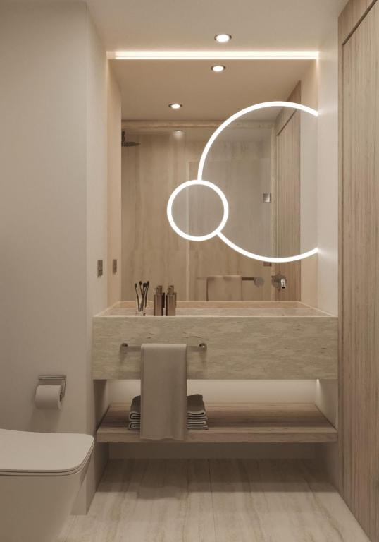 a bathroom with a tub and a sink and a toilet at Ducale Lara - Ultra All Inclusive in Lara