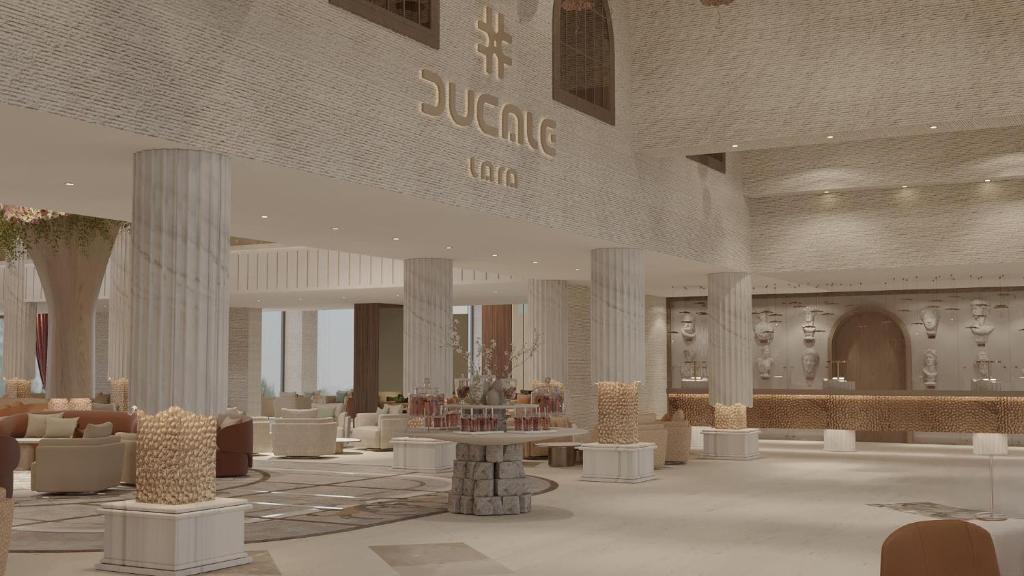 a rendering of a lobby with tables and chairs at Ducale Lara - Ultra All Inclusive in Lara