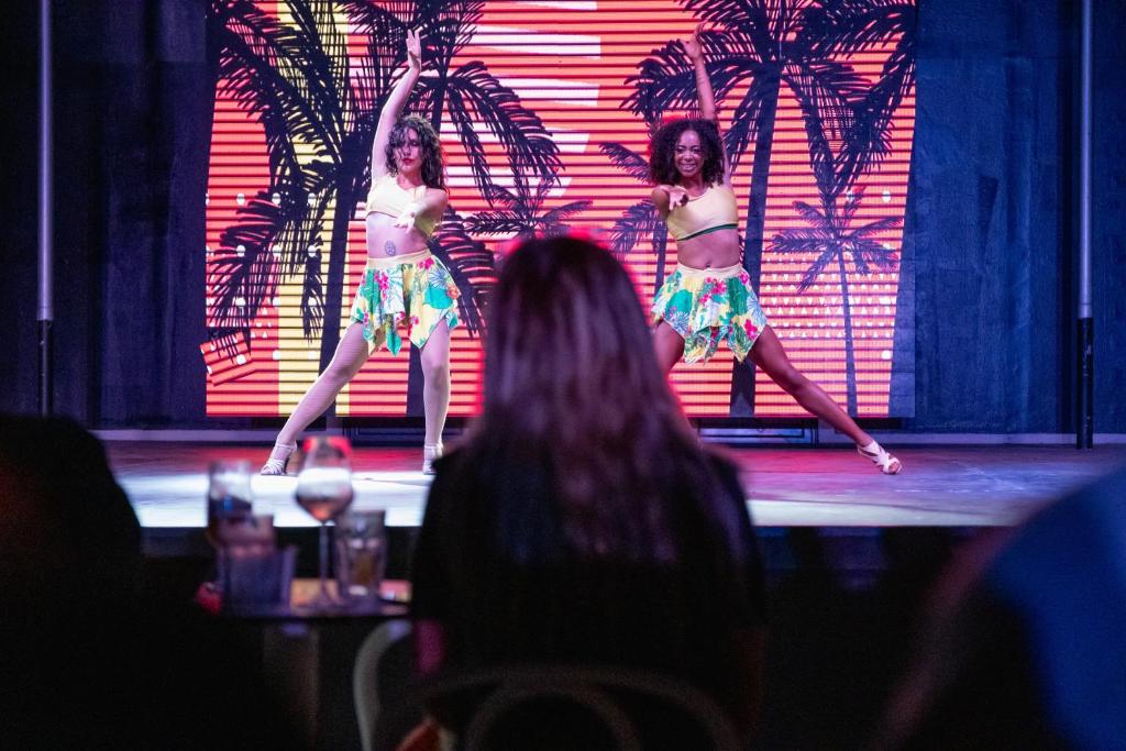 two girls in bathing suits performing on a stage at Ducale Lara - Ultra All Inclusive in Lara