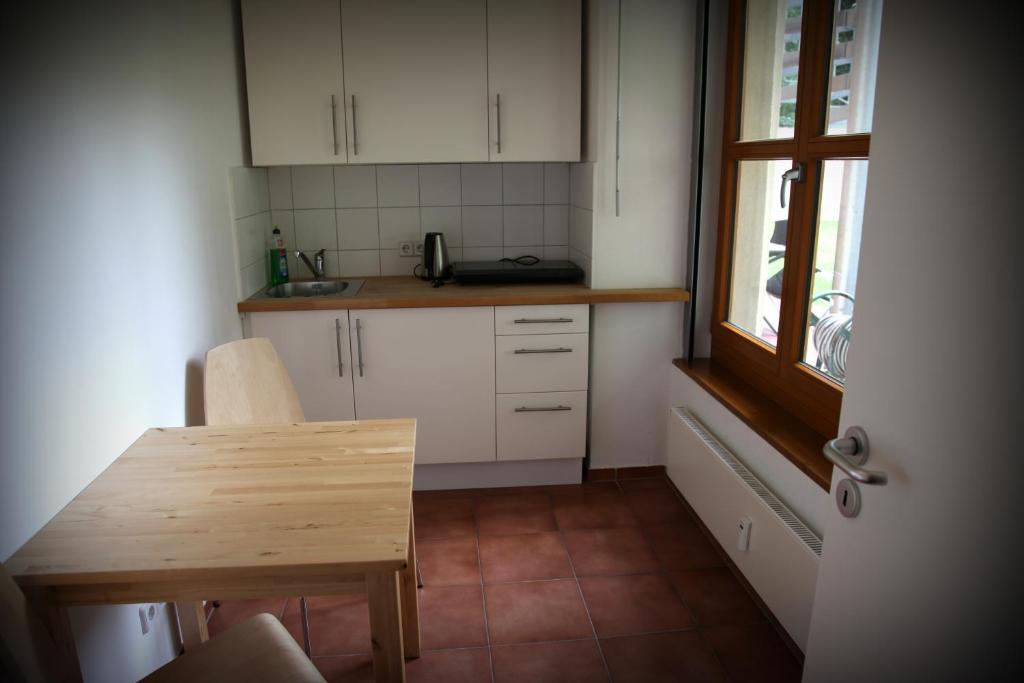Kuchyň nebo kuchyňský kout v ubytování Hotel 26