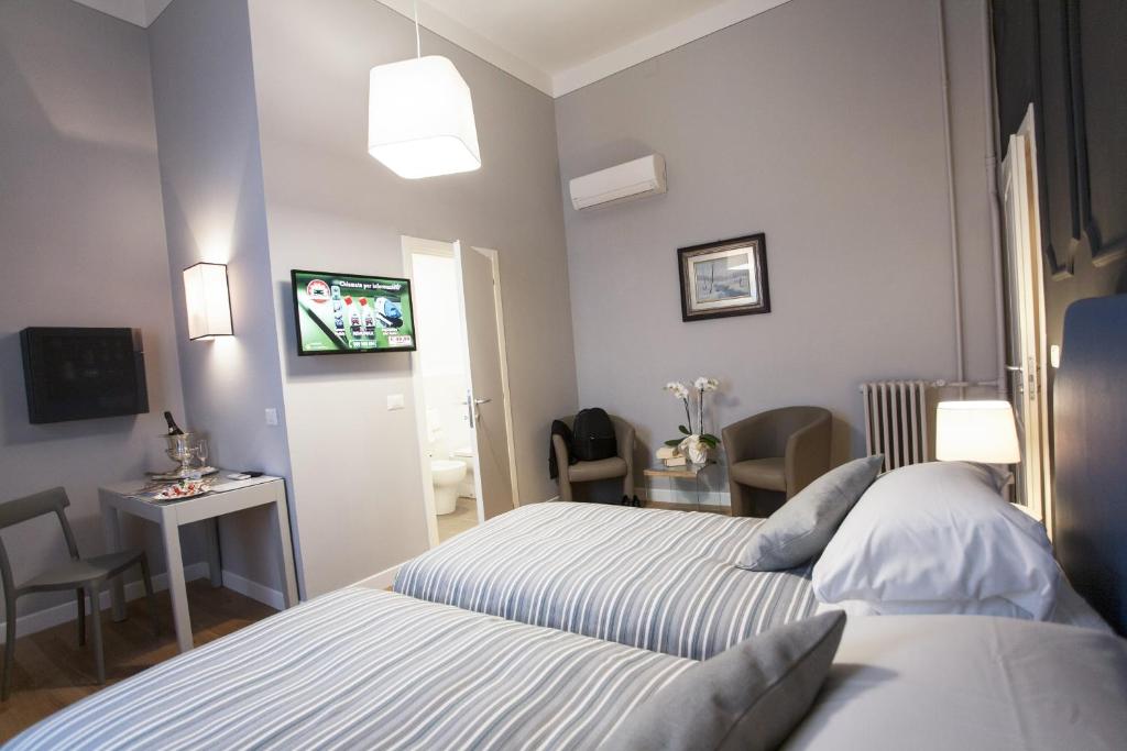 Postel nebo postele na pokoji v ubytování Hotel Il Sole