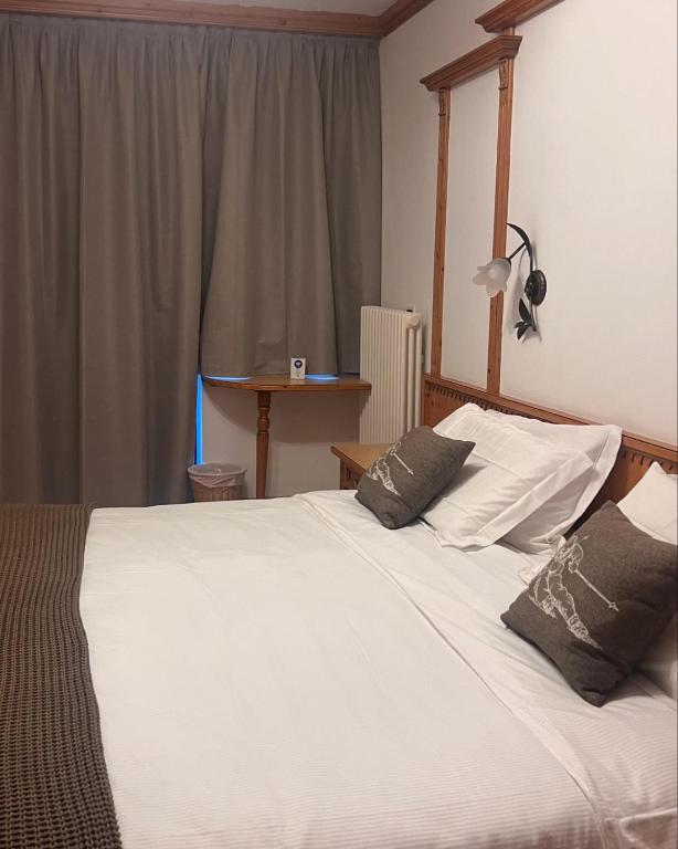 Postel nebo postele na pokoji v ubytování Hotel Valle Verde - Rent Ski & Bike