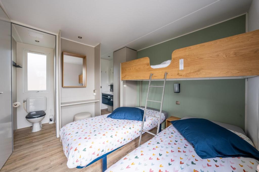 Postel nebo postele na pokoji v ubytování hu Birkelt village