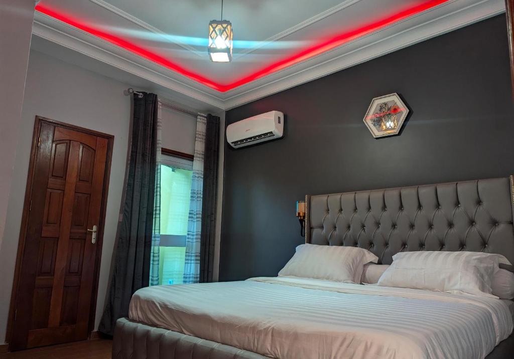 Postel nebo postele na pokoji v ubytování hôtel le CALOMA