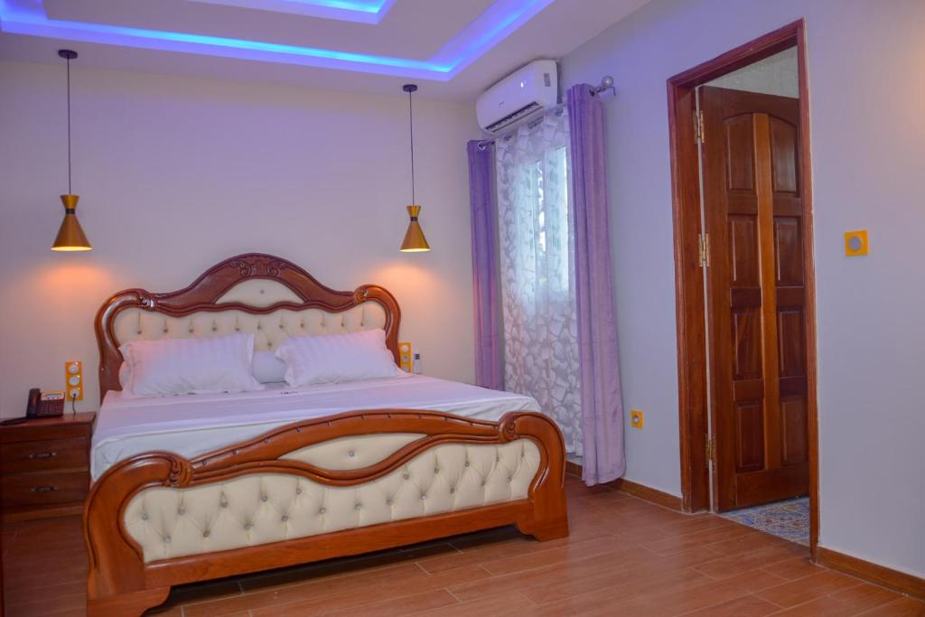 Postel nebo postele na pokoji v ubytování hôtel le CALOMA