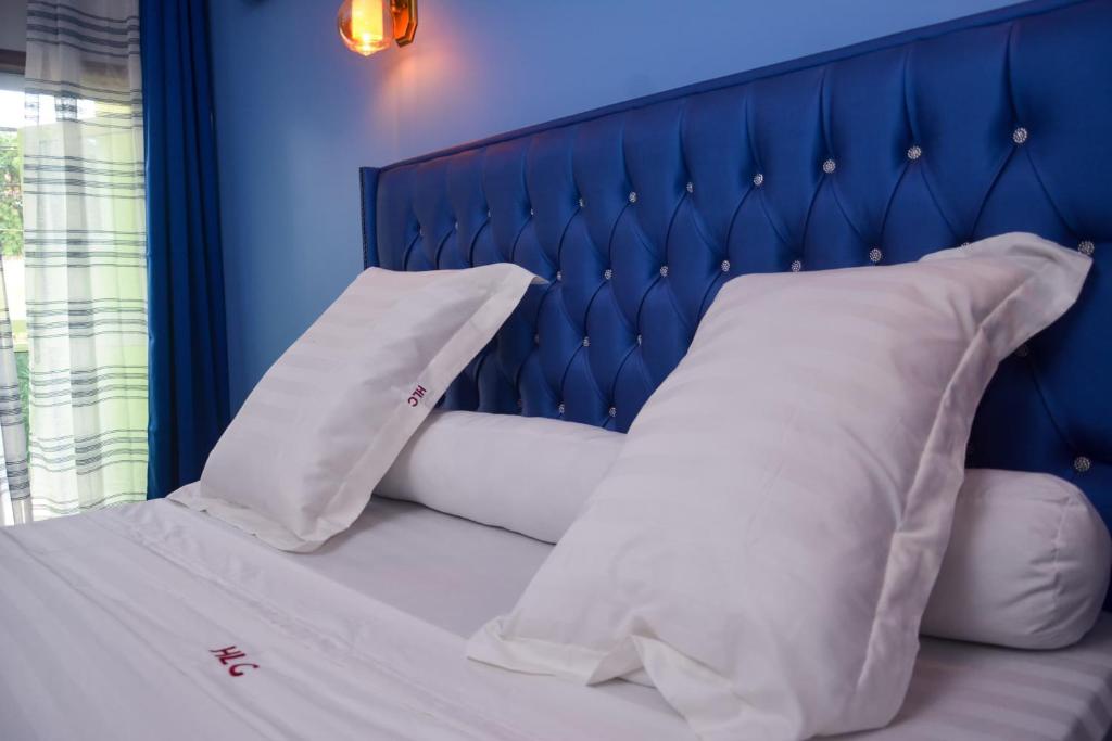 Postel nebo postele na pokoji v ubytování hôtel le CALOMA