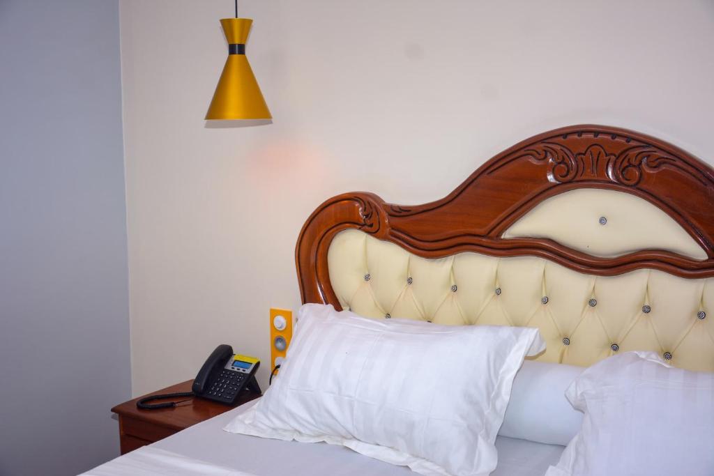 Postel nebo postele na pokoji v ubytování hôtel le CALOMA