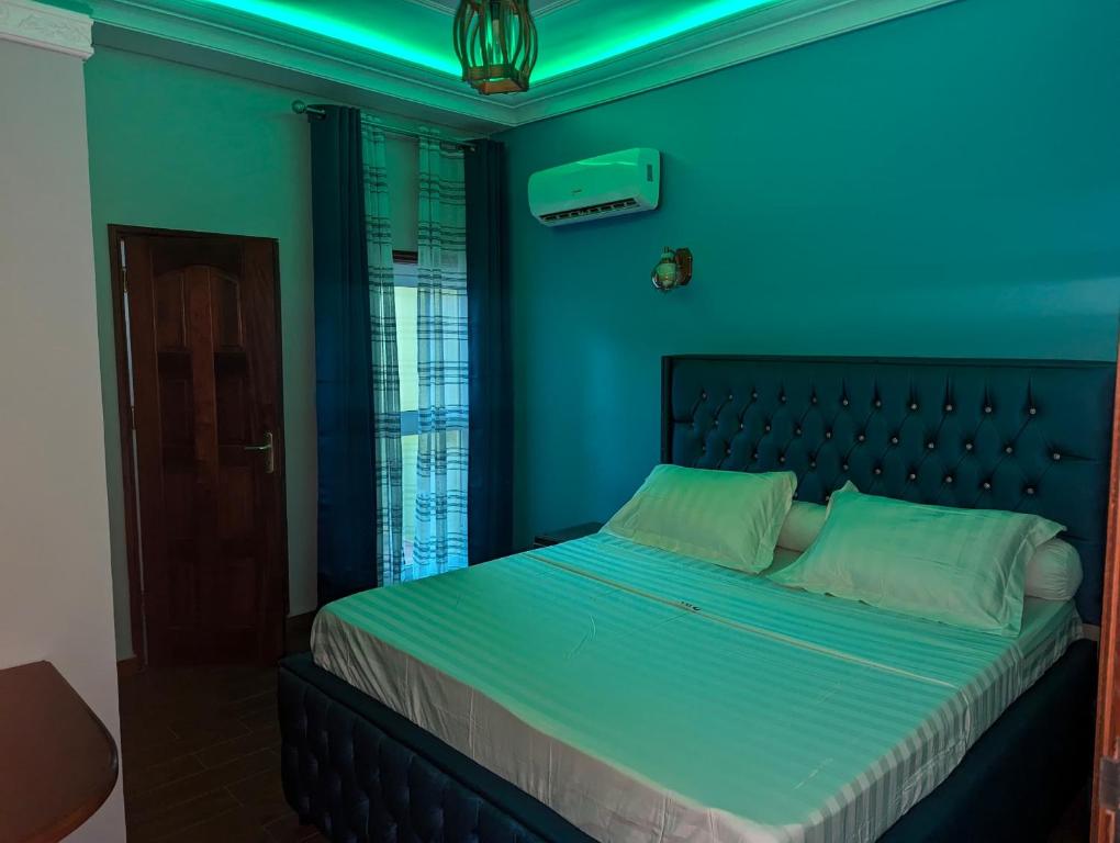 Postel nebo postele na pokoji v ubytování hôtel le CALOMA