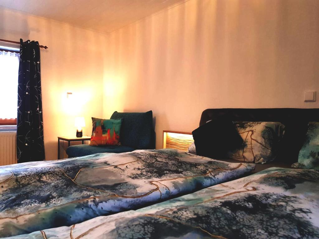 Postel nebo postele na pokoji v ubytování Ferienhaus TraunseeStrand