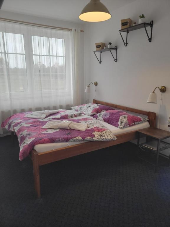 Postel nebo postele na pokoji v ubytování Pension Pastis