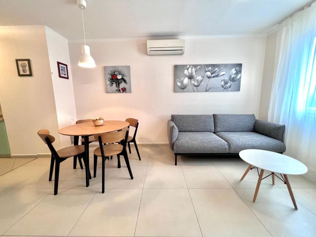 a living room with a couch and a table at Apartment Family in Zagreb