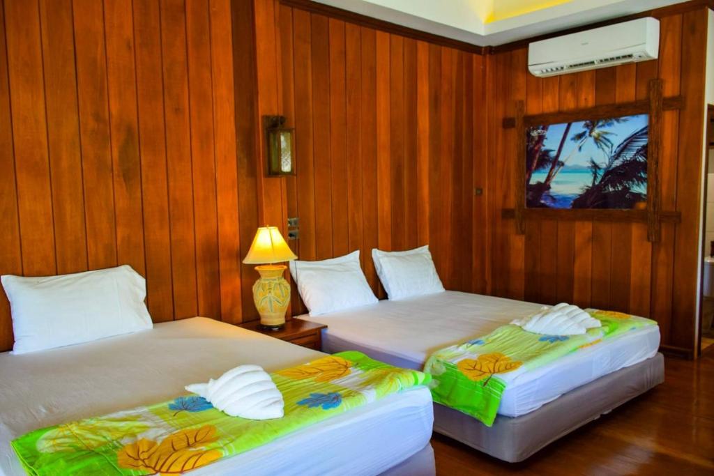 Postel nebo postele na pokoji v ubytování The Mangrove Hideaway Kohchang