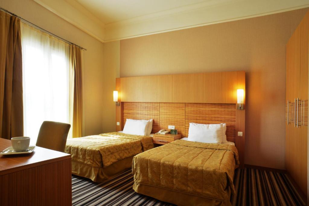 Postel nebo postele na pokoji v ubytování Grand Cettia Hotel