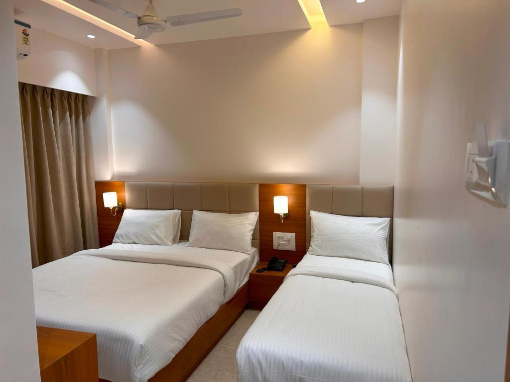 Postel nebo postele na pokoji v ubytování Hotel Neem Heritage