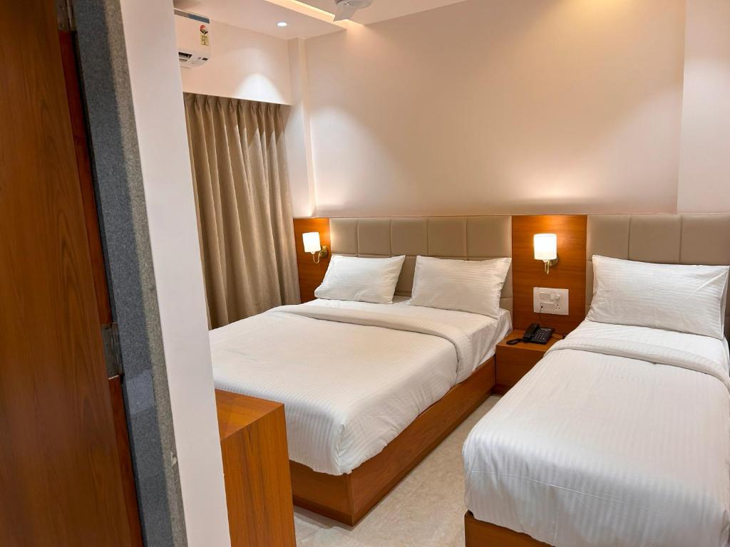 Postel nebo postele na pokoji v ubytování Hotel Neem Heritage