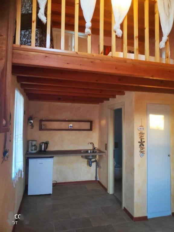 Kuchyň nebo kuchyňský kout v ubytování Santanna Suites