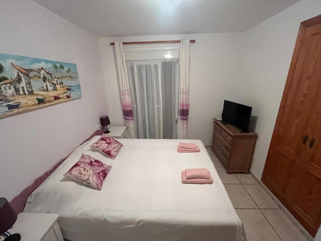 Postel nebo postele na pokoji v ubytování Bougain-casa