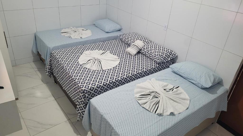 Postel nebo postele na pokoji v ubytování Suite Pajuçara