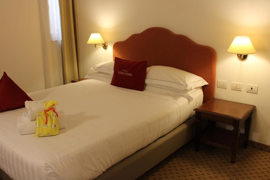 Posteľ alebo postele v izbe v ubytovaní Cora Hotels Leon d'Oro