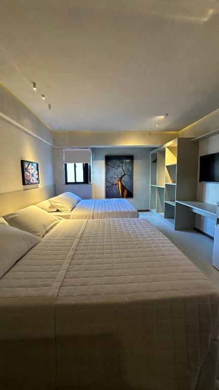 Postel nebo postele na pokoji v ubytování Loft 1 Edf celita Franca Business hotel