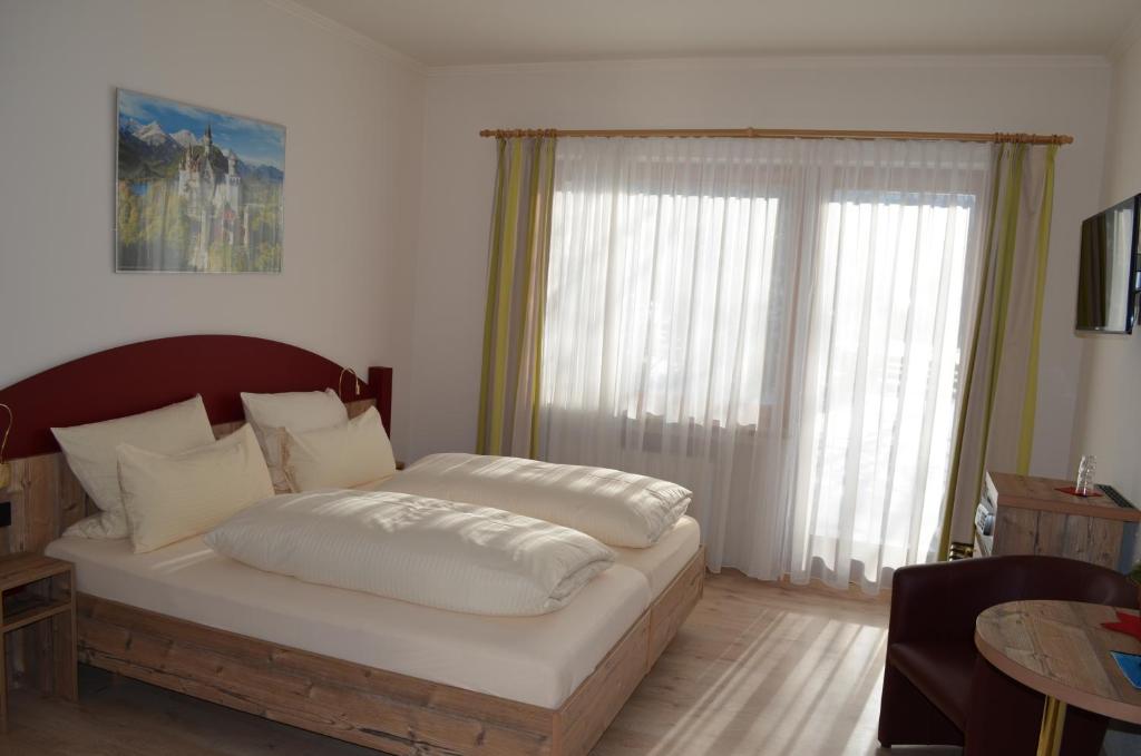 Postel nebo postele na pokoji v ubytování Alpchalet Schwanstein
