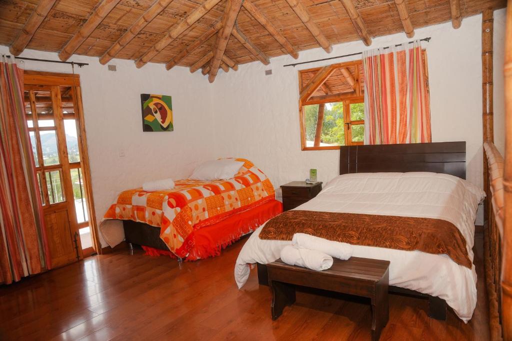Postel nebo postele na pokoji v ubytování Hotel Campestre Inaoska Ecospa