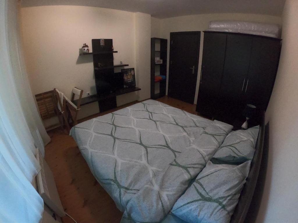 Postel nebo postele na pokoji v ubytování Apartment Atanasov - Pamporovo