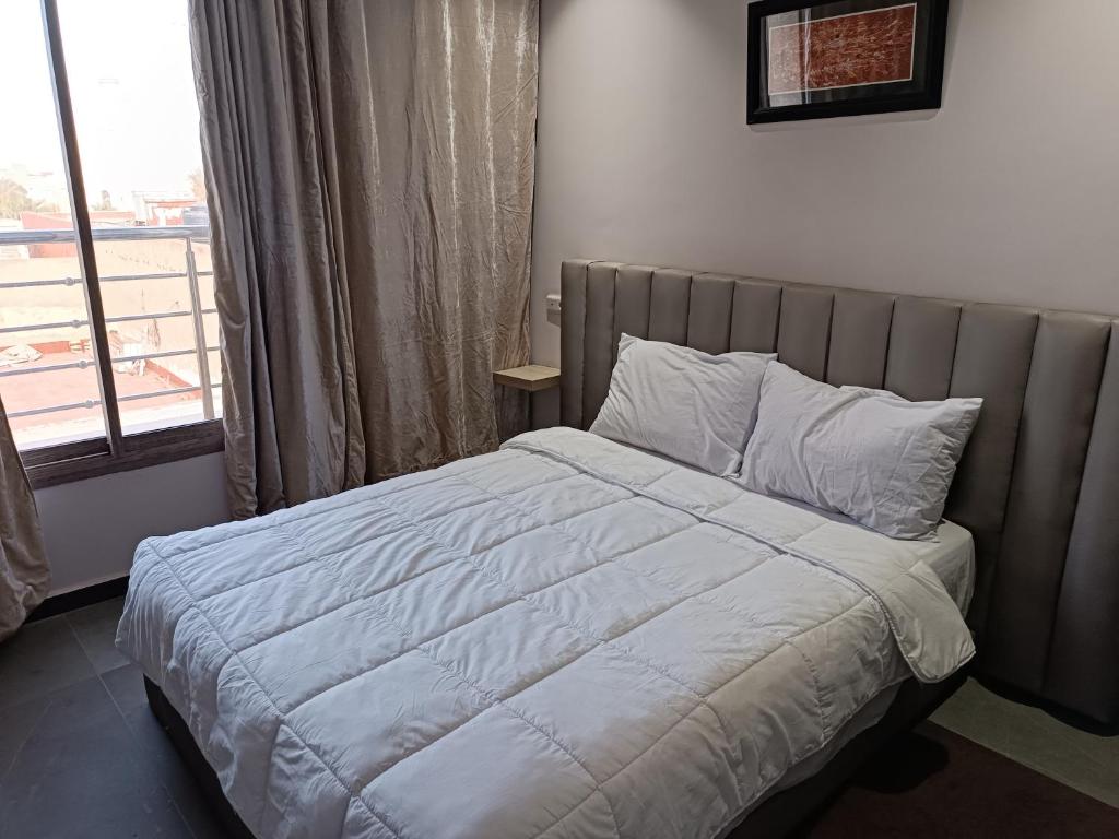 Postel nebo postele na pokoji v ubytování HOTEL Dar Al Oumda