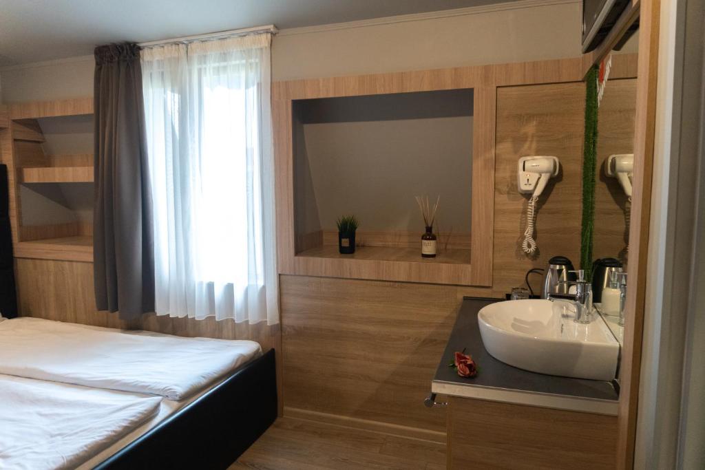 Postel nebo postele na pokoji v ubytování Hotel Allur