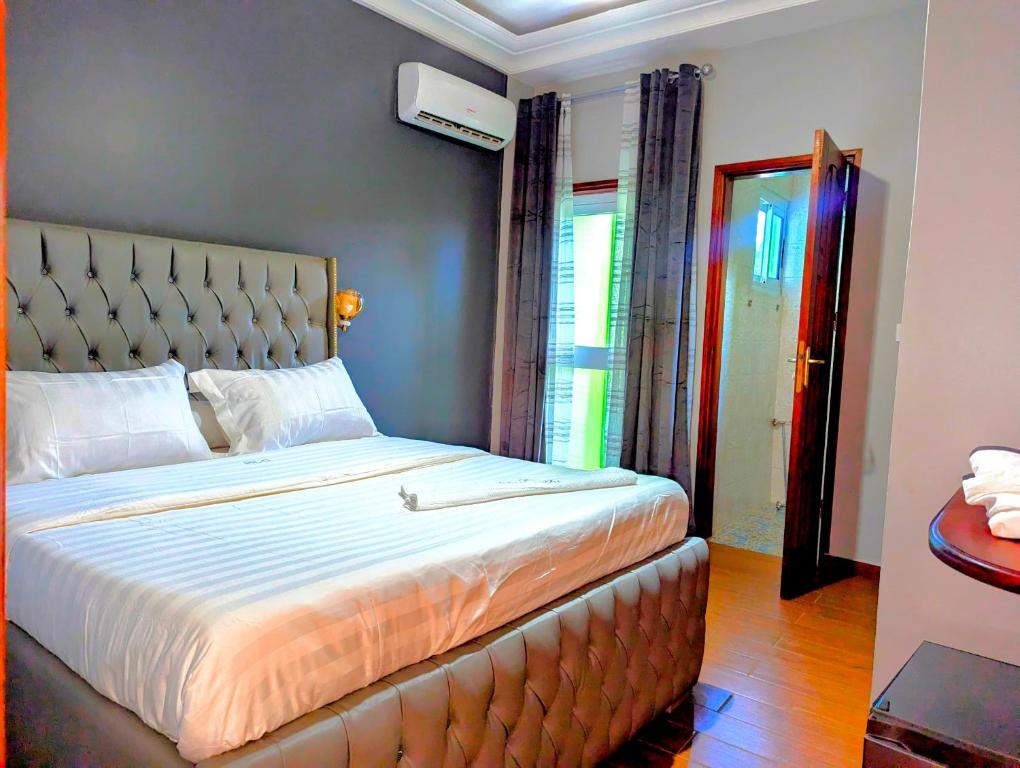 Postel nebo postele na pokoji v ubytování hôtel le CALOMA