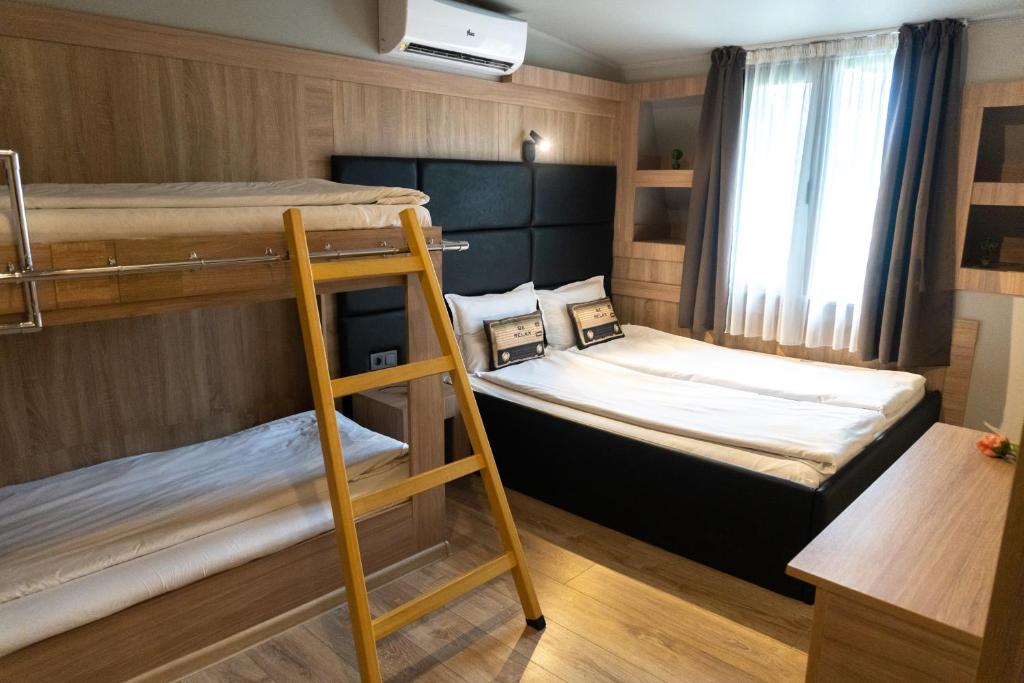 Postel nebo postele na pokoji v ubytování Hotel Allur