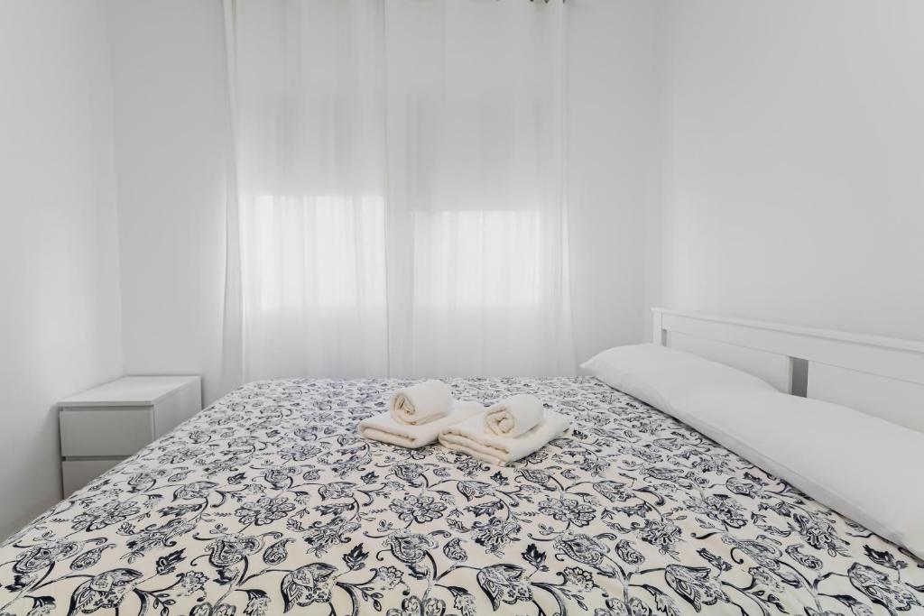Postel nebo postele na pokoji v ubytování Urban Nest Suites
